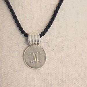 Pendant with "M" initial